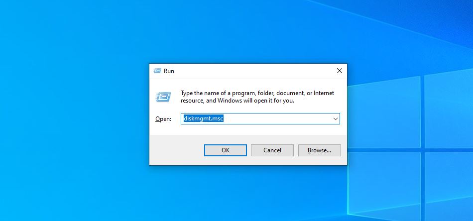 Windows Run dialog box with "diskmgmt.msc" entered, ready to open the Disk Management tool.